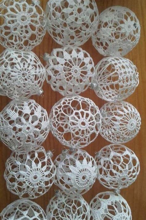 White Crochet Doily Balls Are Arranged On A Wooden Surface Ready To Be