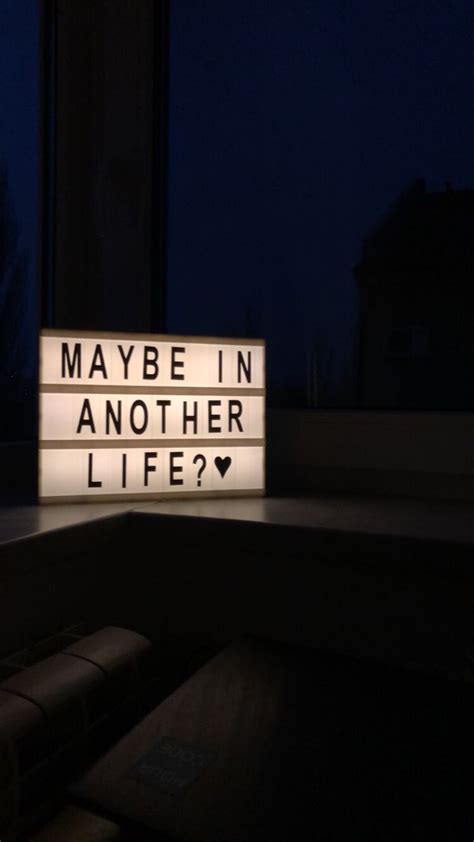 A Lighted Sign That Says Maybe In Another Life