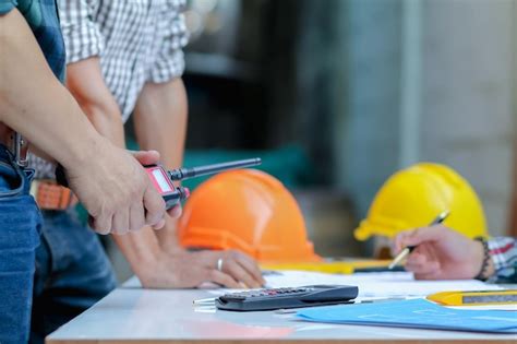 Premium Photo Midsection Of Engineers Working At Site