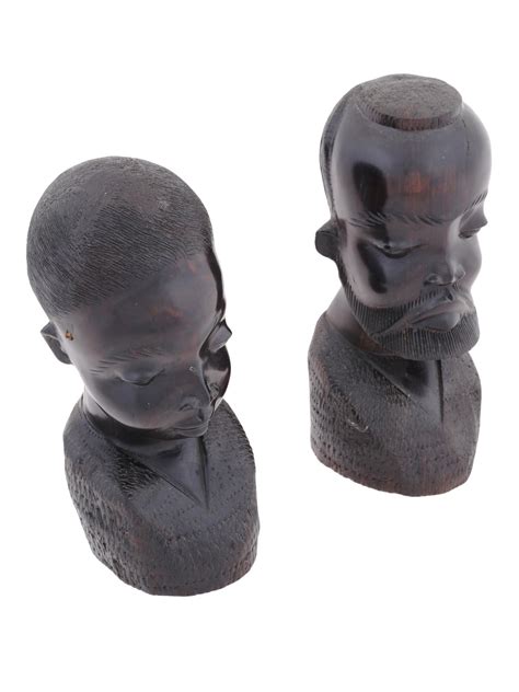 At Auction VINTAGE AFRICAN CARVED EBONY MALE AND FEMALE FIGURINES