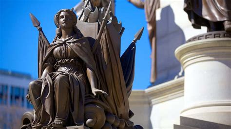 Download A Female Bronze Statue At The Virginia State Capitol Wallpaper