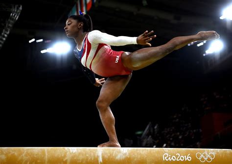 PHOTOS: Simone Biles & The USA Gymnastics Team Fly Into First Place