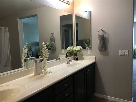 Staging A Bathroom With Simple Decor Bring In Some Height With Florals