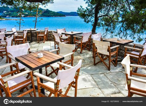 Greek tavern in Skiathos with view over the blue sea Stock Photo by ...