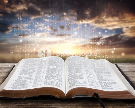 Open glowing Bible on table at sunset Royalty-Free Stock Image ...