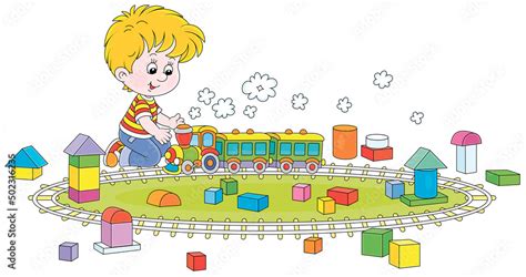 Happy Little Boy Playing With A Toy Railway Train And Cubes Of