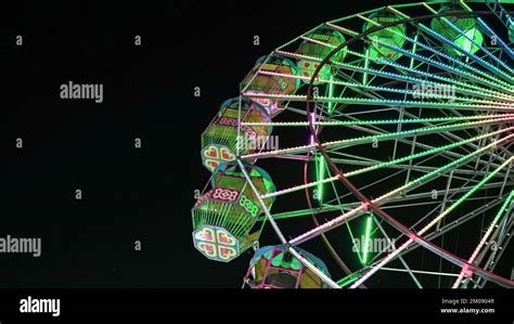 Giant Ferris Wheel With Green Lighting In An Exhibition Indian Fair At