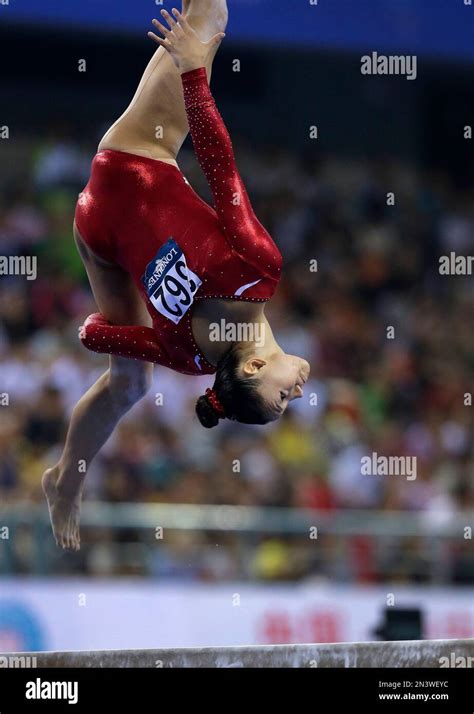 Kyla Ross Of The United States Keeps Her Eyes On The Balance Beam As