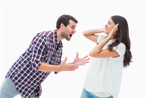 Premium Photo Fearful Brunette Being Overpowered By Boyfriend