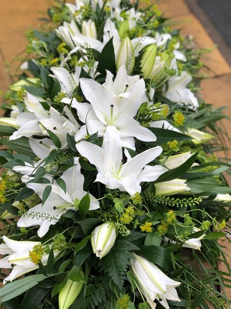 White Lily Casket Spray Casket Tributes Vanilla Blue Flowers