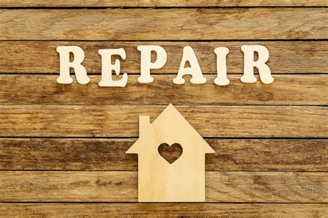 Premium Photo Word Repair Made Of Wooden Letters And House Model On A