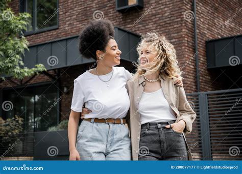 Overjoyed Multiethnic Lesbian Couple Hugging And Stock Image Image Of