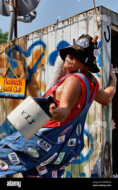 Man With Jug Of Moonshine On Hillbilly Float In Oldest Continuous Stock