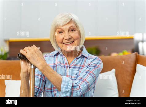Modern Aged Lady With A Cane Smiling Happily Stock Photo Alamy