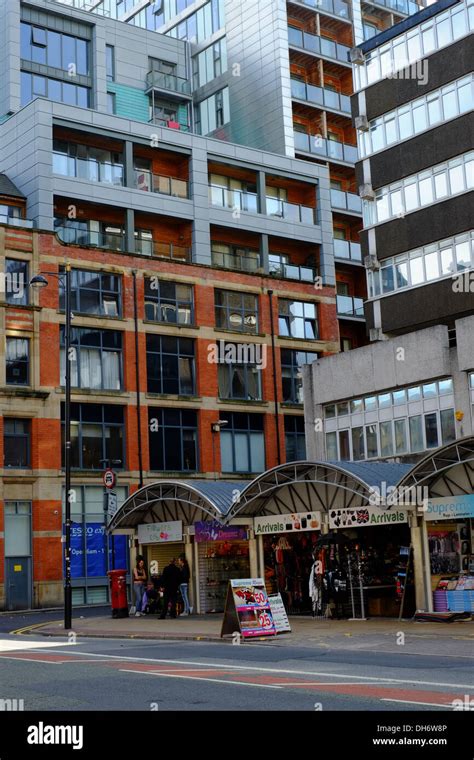 Small Retail Outlets Overlooked By Modern Apartment Buildings
