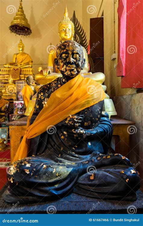 Sitting Black Buddha Statue With Gold Leaf Stock Photo Image Of