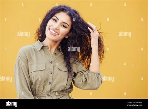 Happy Arab Woman With Curly Hair In Urban Background Young Arab Woman