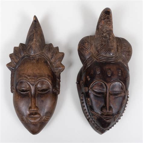 At Auction Two African Carved Wood Masks