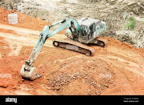 Excavator Digging Soil In The Construction Site Stock Photo Alamy