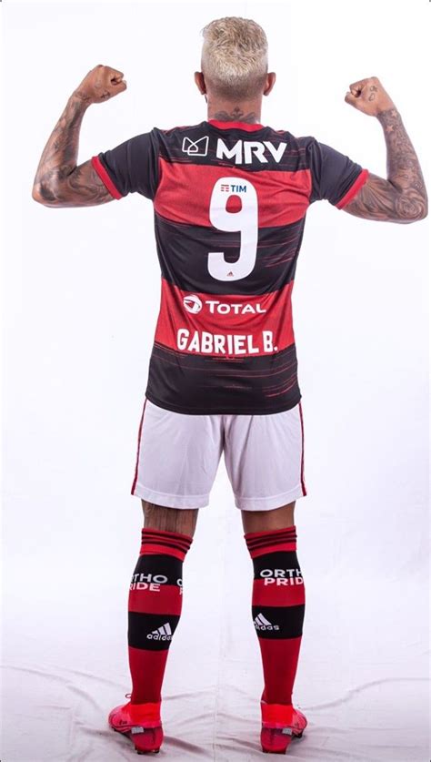 A Man With Tattoos On His Arms And Legs Wearing A Jersey That Says Mrv