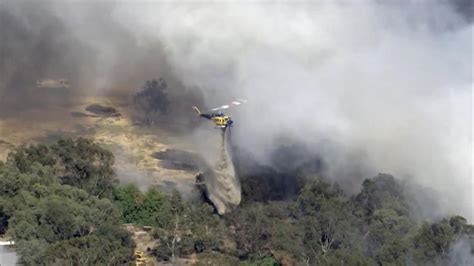 Dozens Evacuate And 10 Homes Are Destroyed By A Wildfire Burning Out Of