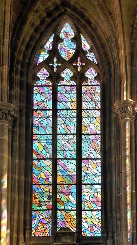 A Large Stained Glass Window In The Middle Of A Building