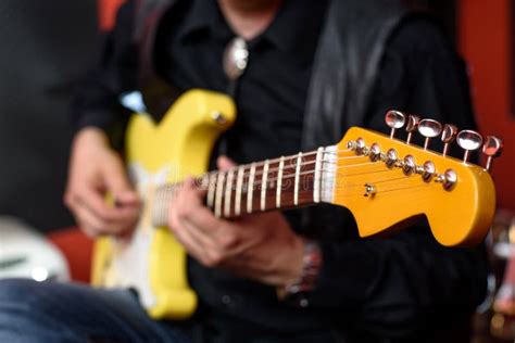 Guitarist With Yellow Fender Electric Guitar Stock Image Image Of