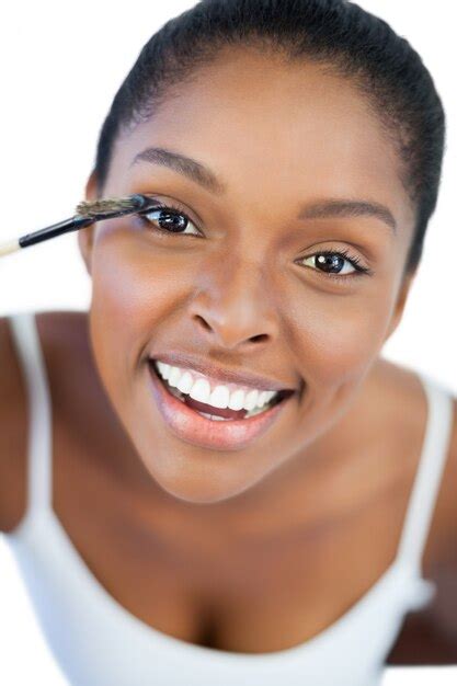 Premium Photo Smiling Woman Putting Mascara On Her Eyelash