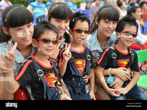 Young Chinese Triplets Pose At The Launch Ceremony Of The 10th Beijing