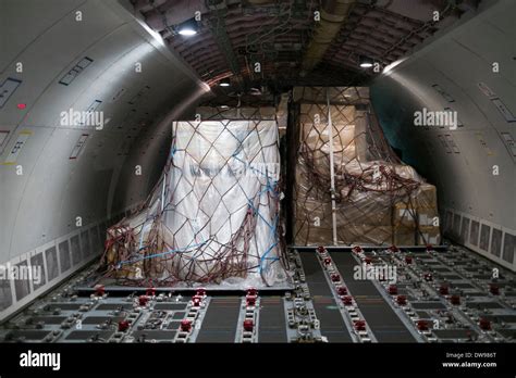 view of cargo aircraft interior with cargo pallets Stock Photo - Alamy