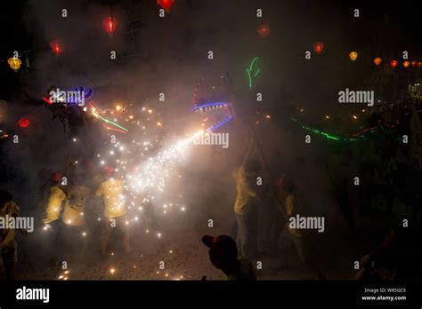 Chinese entertainers perform a fire dragon dance to celebrate the Mid ...