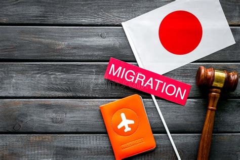 Migration To Japan Concept Japanese Flag Near Passport And Judge Hammer On Dark Wooden