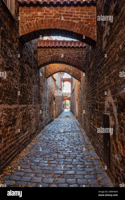 Medieval Alleyway In Old Town Of Elblag City In Poland Narrow Cobblestone Passage Between