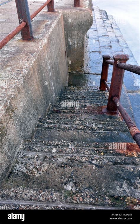 A Set Or Flight Of Steps Or Stairs Leading Down To The Sea On The Beach