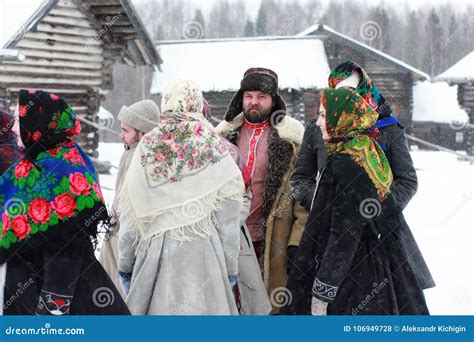 Couple In Traditional Winter Costume Of Peasant In Russia Stock Photo