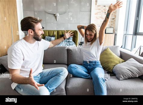 Young Couple Have Fun Relaxing On Sofa Love Happiness People And Fun