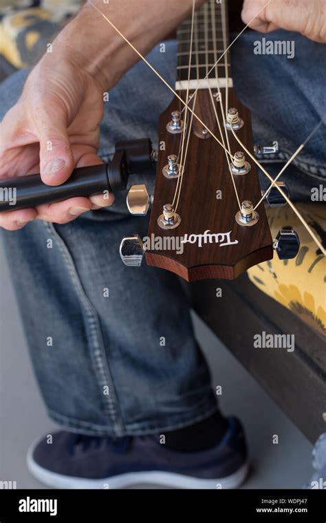 Restringing Acoustic Guitar Stock Photo - Alamy