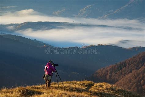 Professional Photographer with Tripod Stock Photo - Image of landscape ...