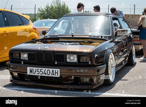 Beautiful Brown Bmw E30 With Square Headlights And An Open Hood Stance