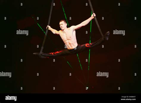 Acrobat Performs A Difficult Trick In The Circus Stock Photo Alamy