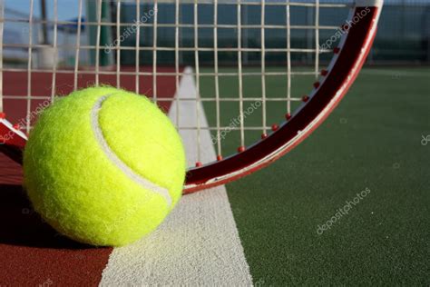 Tennis Ball and Racket Stock Photo by ©33ft 10697940