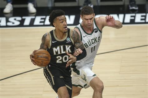 Atlanta Hawks Re Sign John Collins Sports Illustrated Toronto Raptors