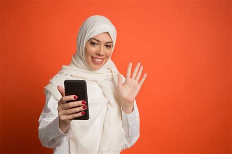 Premium Photo Arab Woman With Hijab Taking A Selfie