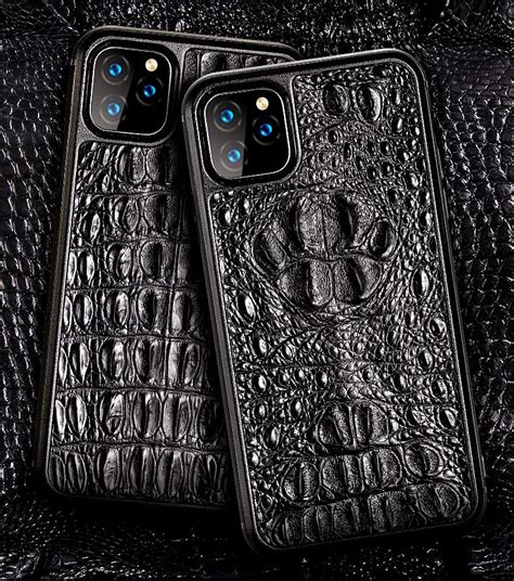 Two Black Alligator Skin Iphone Cases With Blue Eyes