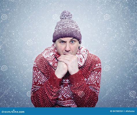 Frozen Man In Sweater Scarf And Hat Warming Hands Cold Snow