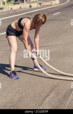 Battling Ropes Woman Outdoor Workout Exercise Fitted Body Stock Photo