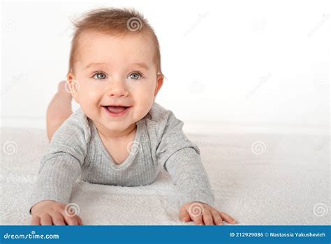 Portrait Of A Cute Baby Boy With Blue Eyes On White Background Stock