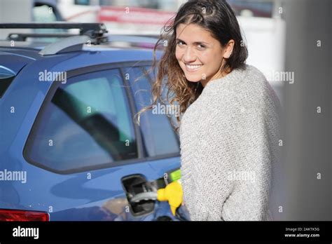 Brunette At Gas Station Stock Photo Alamy