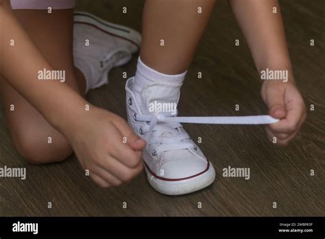 Kid Tying Shoes Little Girl Struggling To Tie Shoe Laces Child