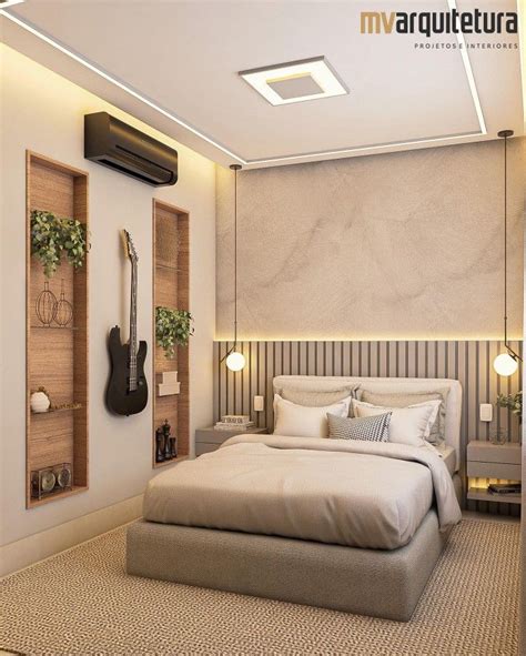 A Bed Room With A Neatly Made Bed And A Guitar Hanging On The Wall Next